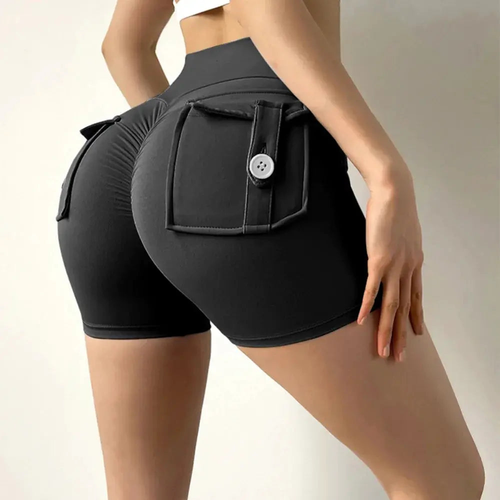 Peach Butt Fitness Shorts for women by Simples Market, black cargo-style yoga shorts with a side pocket and button.
