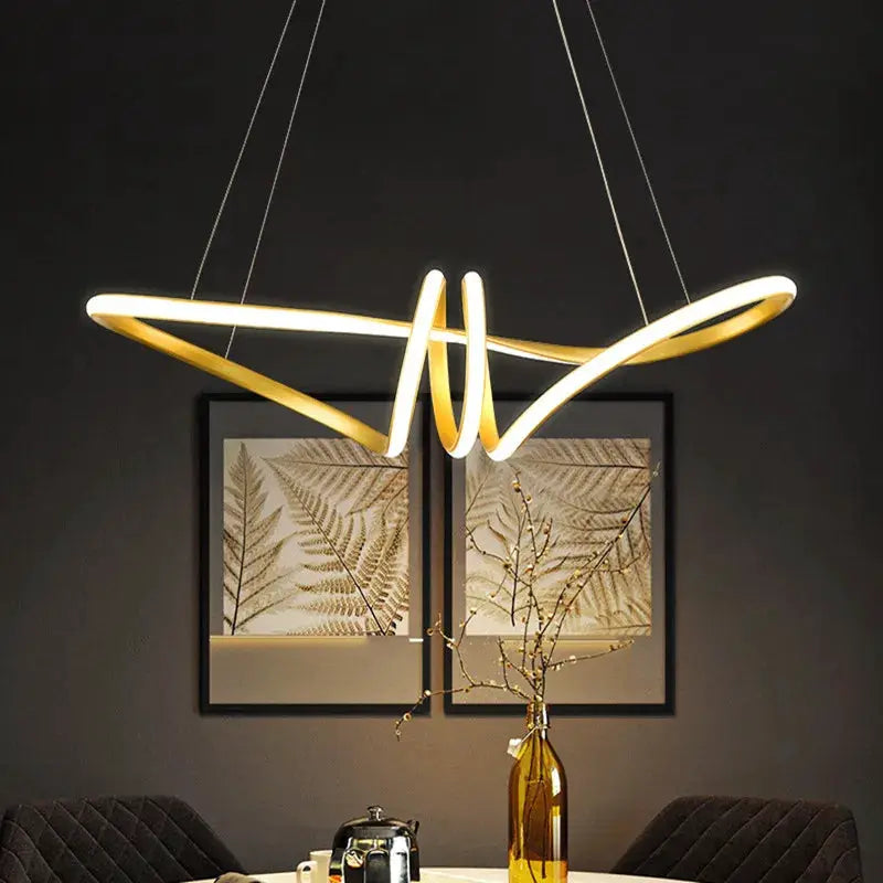 Modern kitchen island pendant light by Simples Market with intertwined LED rings and warm glow