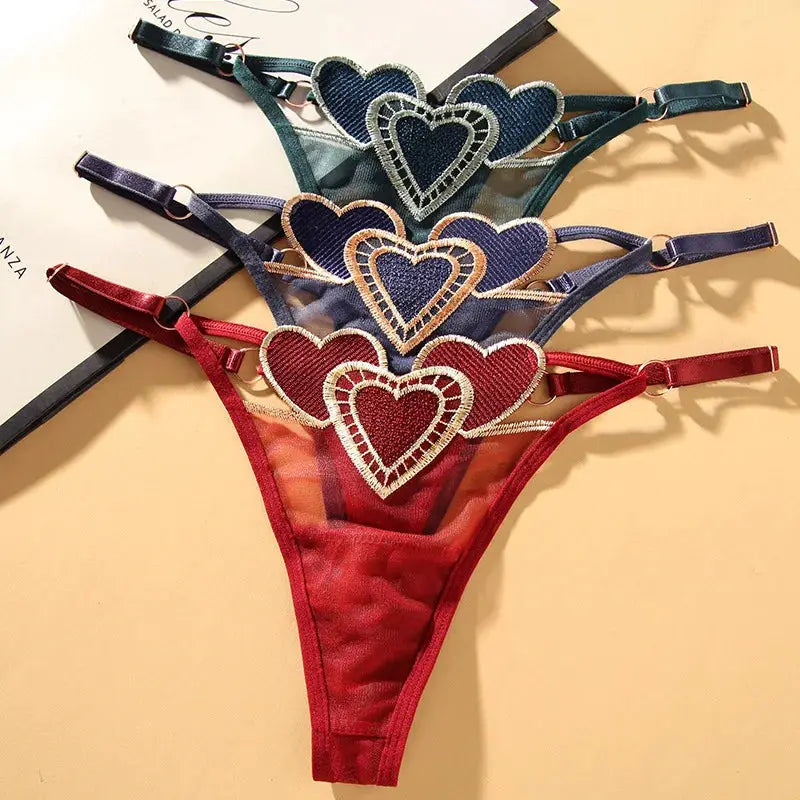 Simples Market 4-pack heart-appliqué thong underwear; breathable mesh, low waist, adjustable straps in assorted colors.