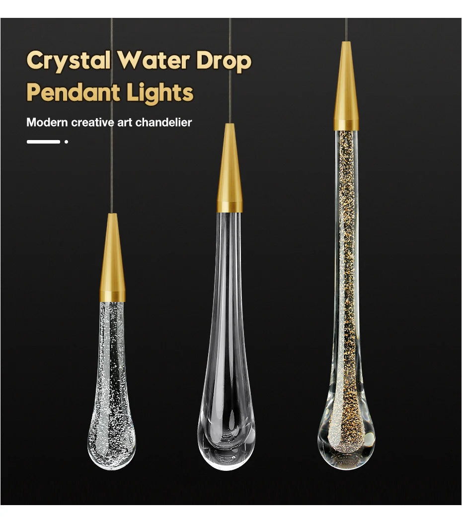 Crystal Water Drop Pendant Lights by Simples Market; gold-cap tops and clear crystal drops, three pendants