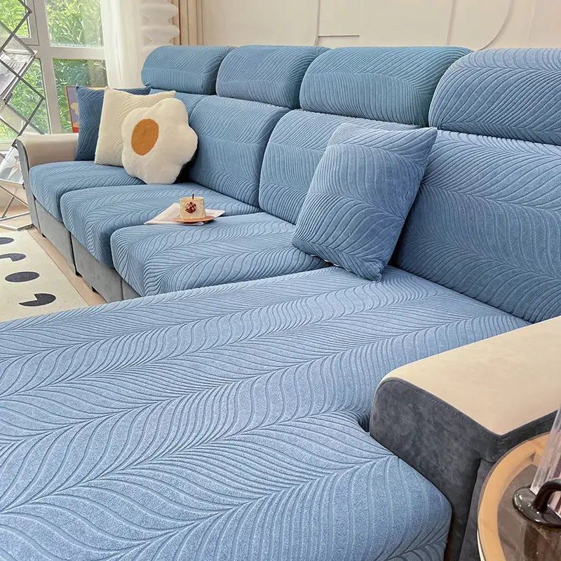 Jacquard blue sofa cover, splash-proof with high elasticity, by Simples Market.