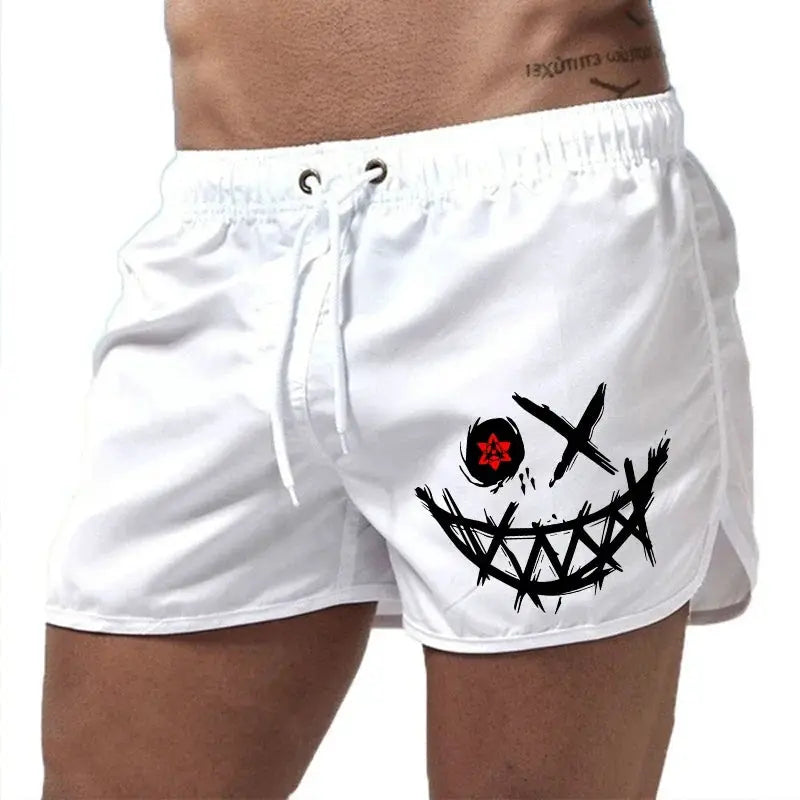 White men's board shorts with drawstring waist and bold black graffiti smile graphic.