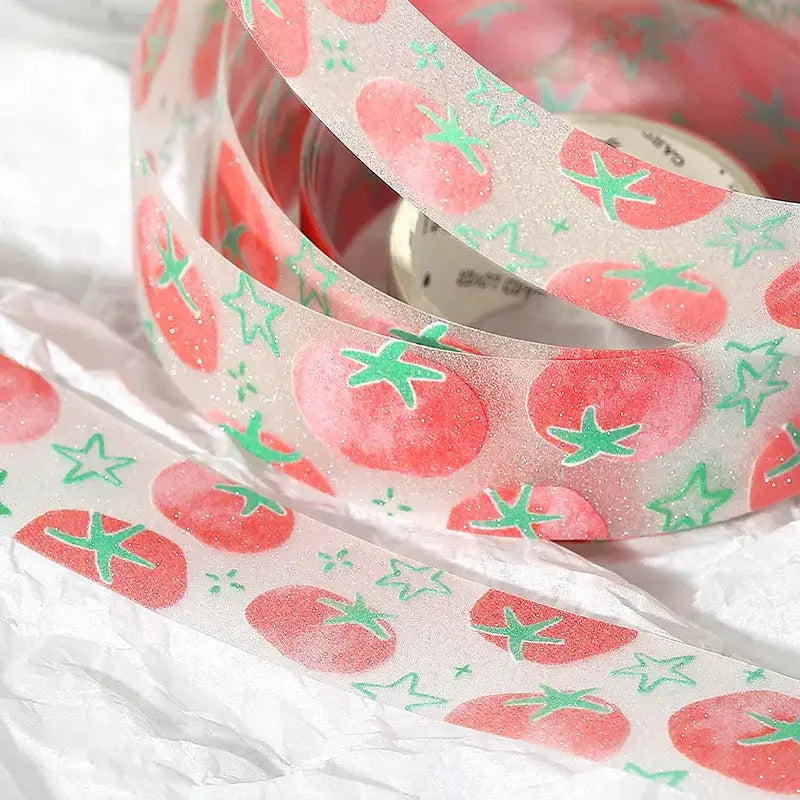 Decorative washi tape roll by Simples Market with pink tomatoes and mint stars for journaling and scrapbooking