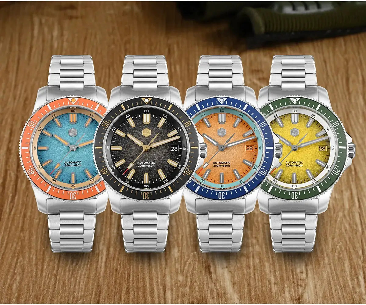 Four San Martin 40mm dive watches on stainless bracelets; turquoise/orange, black, orange/blue, yellow/green.