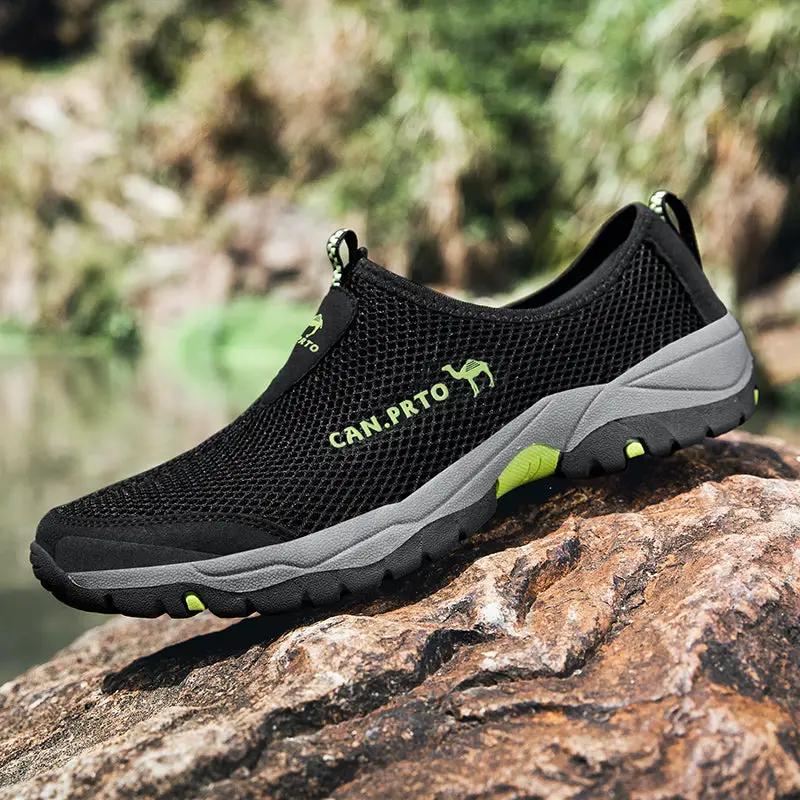Men's black mesh slip-on outdoor shoes with lime green accents and rugged gray sole