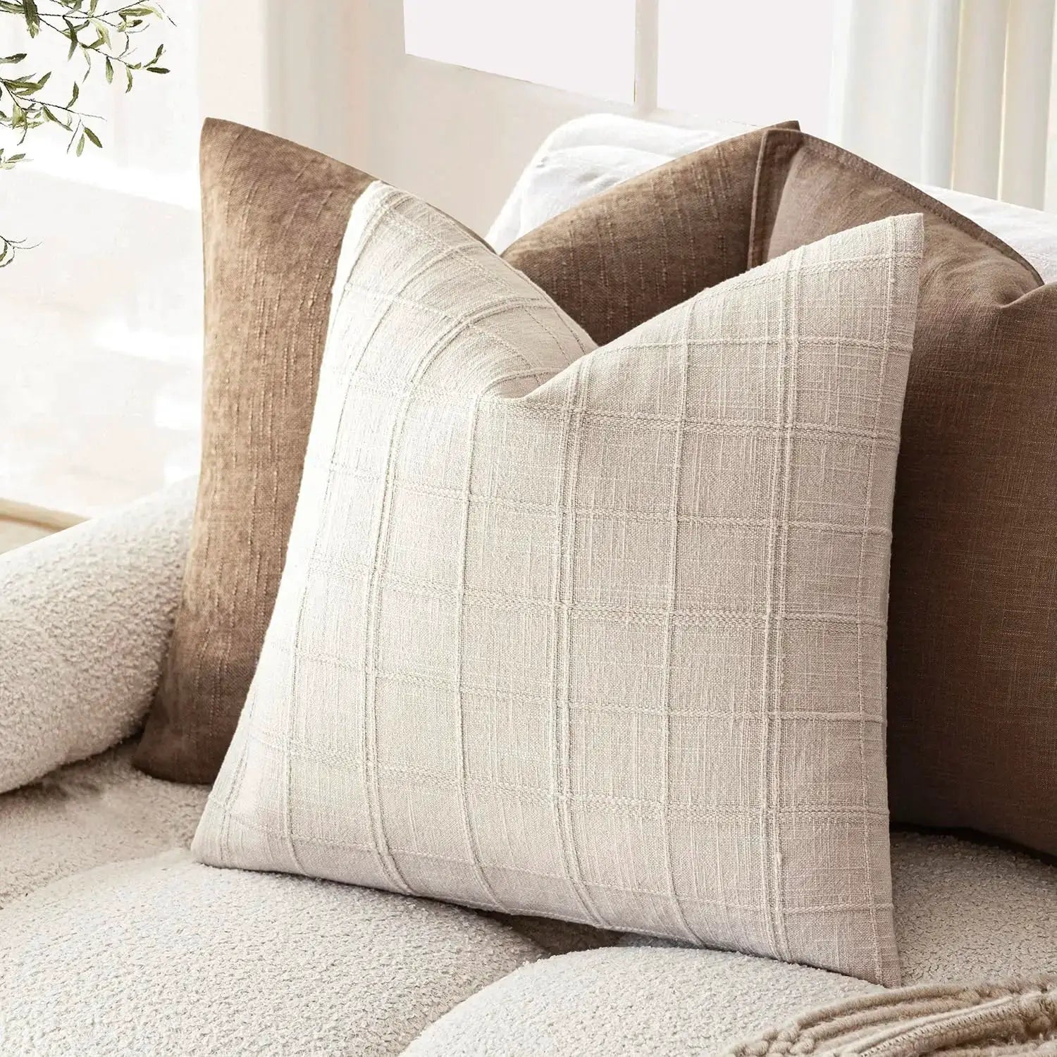 Beige square linen cushion cover with a subtle grid pattern for sofa decor