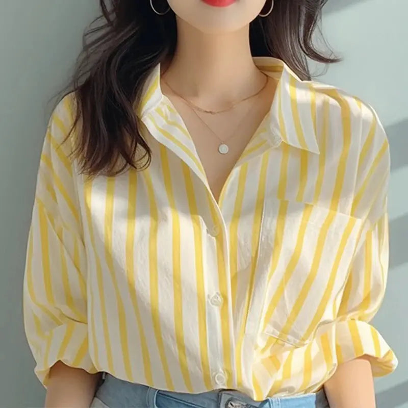 Yellow and white striped women's shirt by Simples Market, casual long-sleeve button-down top with chest pocket.