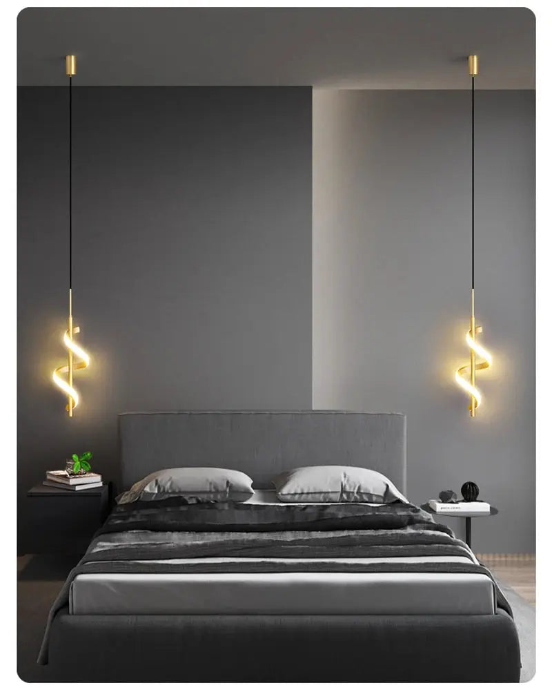 Lustre LED pendant lamps, gold finish with spiral glow, two pendant lights over a gray modern bedroom.