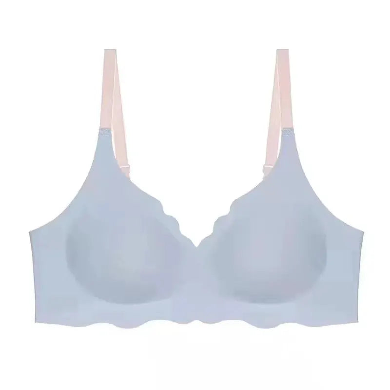 No Trace Top women's bra by Simples Market; light blue wireless design with pink adjustable straps.