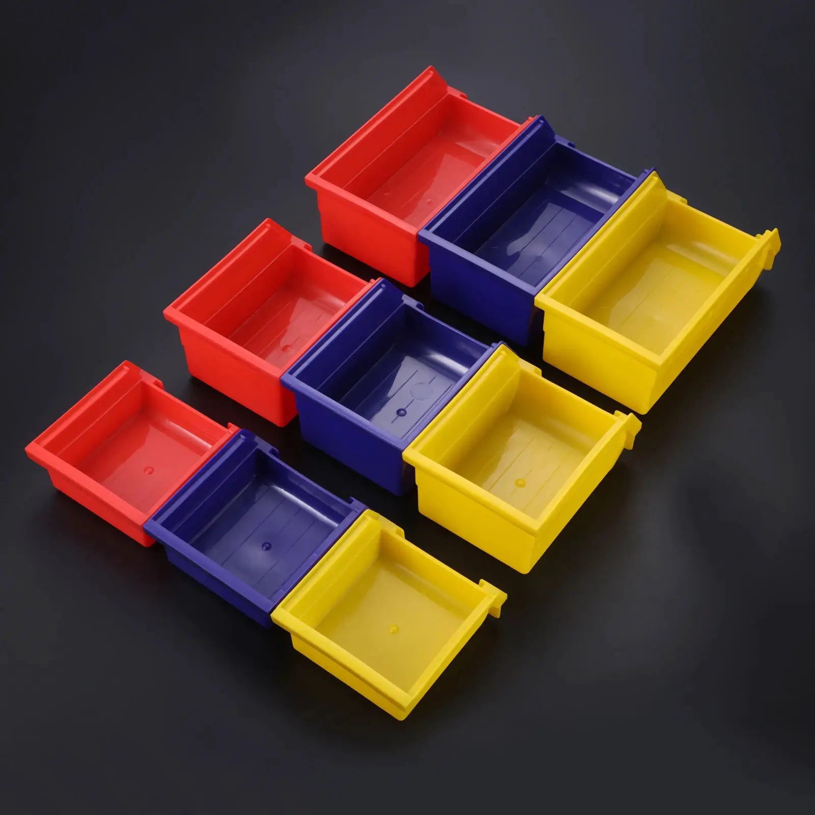 ABS stackable storage bins in red, blue, and yellow; nine-piece color set shown.