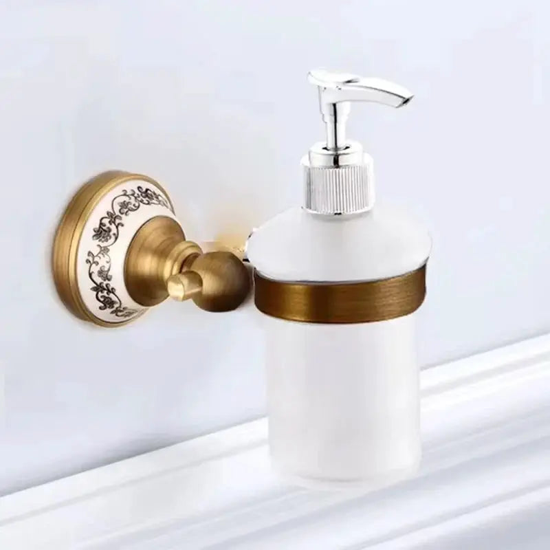 Antique brushed solid brass wall-mounted soap dispenser with white porcelain container and chrome pump