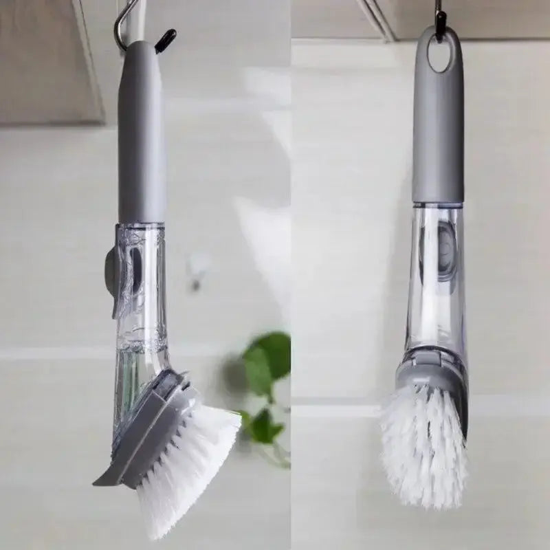 Gray long-handled dish soap dispenser with built-in brush, clear reservoir and white bristles.