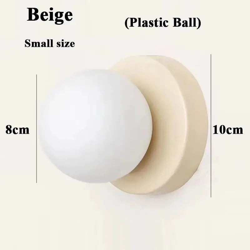 Small beige wall lamp with iron base and plastic ball shade, Simples Market.