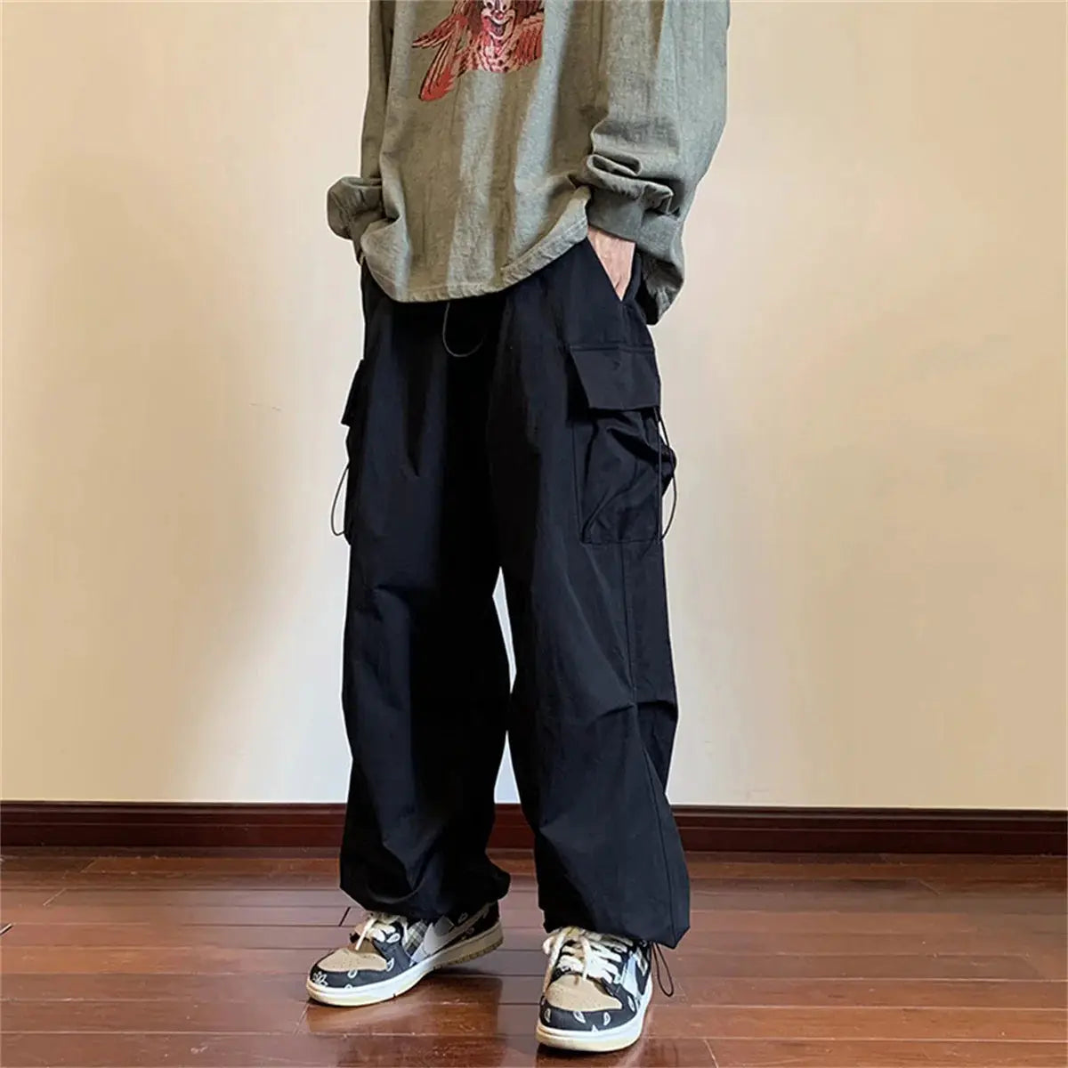 Cargo pants, black, loose baggy fit with multiple pockets and elastic waist by Simples Market