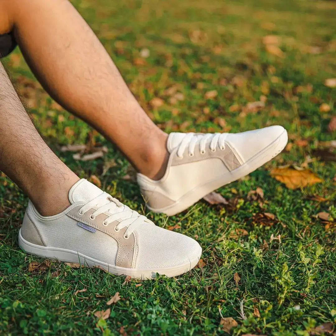 HOBIBEAR unisex wide-toe barefoot shoes in cream white, lightweight breathable sneakers on grass