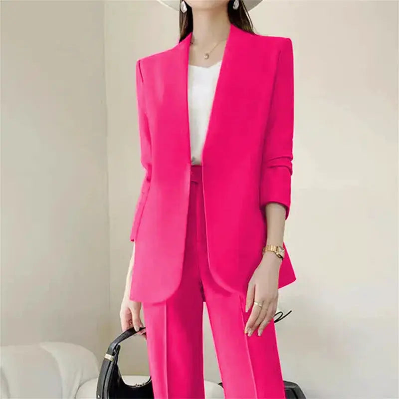 Two-piece pink women's suit: blazer and matching trousers with white top, elegant commuter look