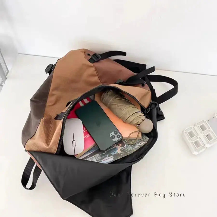 New Y2k portable light nylon crossbody bag in tan and black, unisex travel shoulder bag shown packed with items.