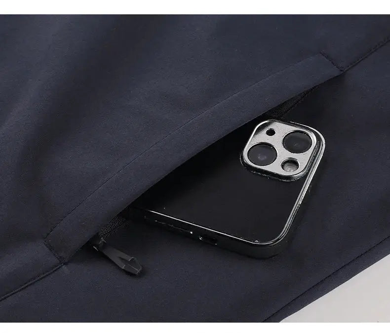 Men's navy waterproof fleece jacket with zip pocket and phone inside
