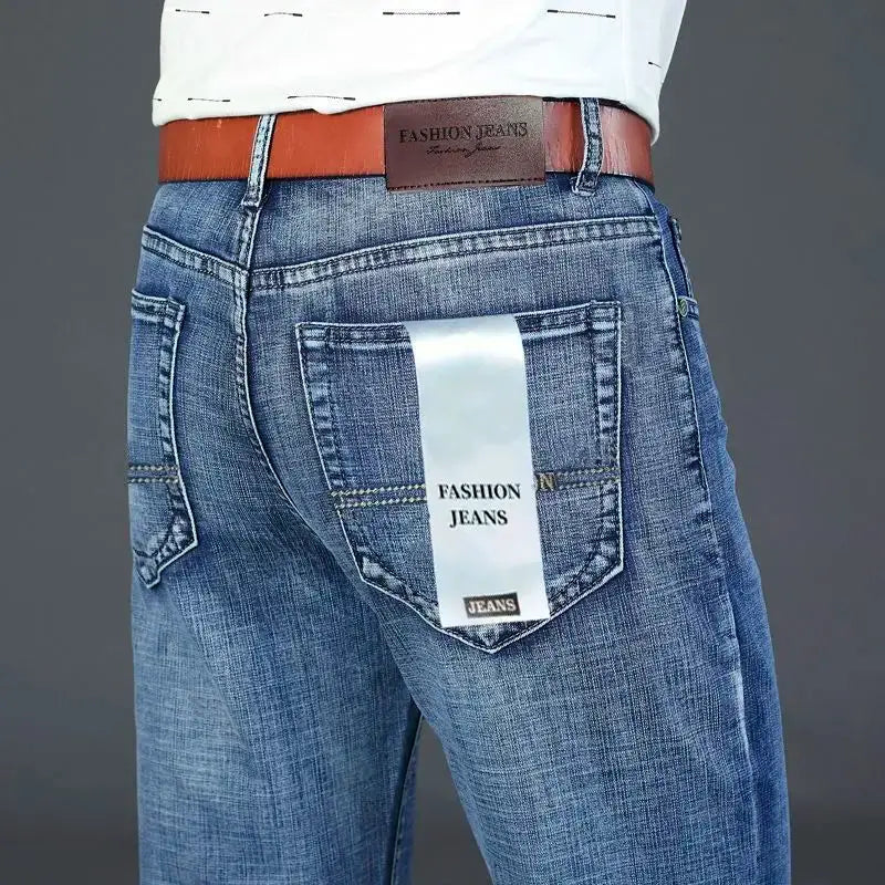 Men's blue denim jeans with back pocket tag reading Fashion Jeans; straight stretch fit