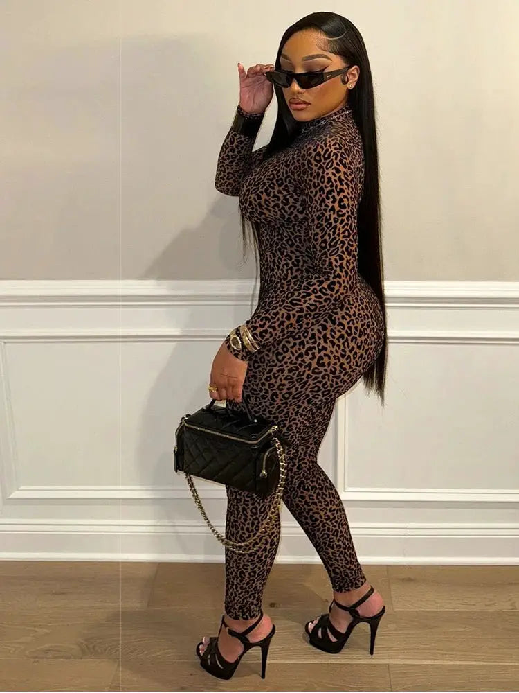 Kliou leopard-print jumpsuit with full sleeves and round neck; slim-fit one-piece for party looks.