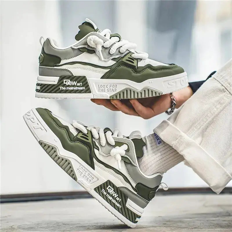 Pair of men's trendy skate shoes in olive green and white with white laces and non-slip sole