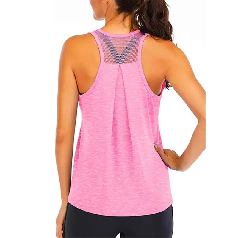 Women's pink yoga vest top with loose fit, sleeveless, mesh back panel