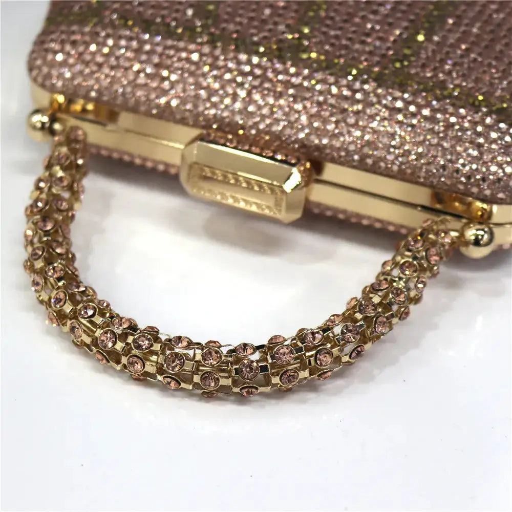 Simples Market evening clutch with rhinestone chain handle and glittery rose-pink body