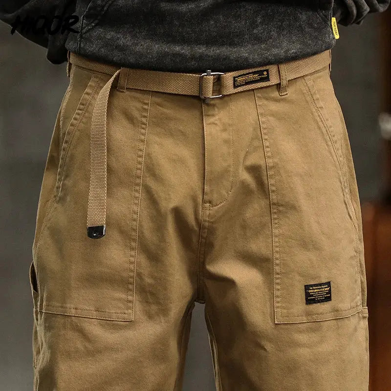 Tan cotton cargo pants with belt and large side pockets
