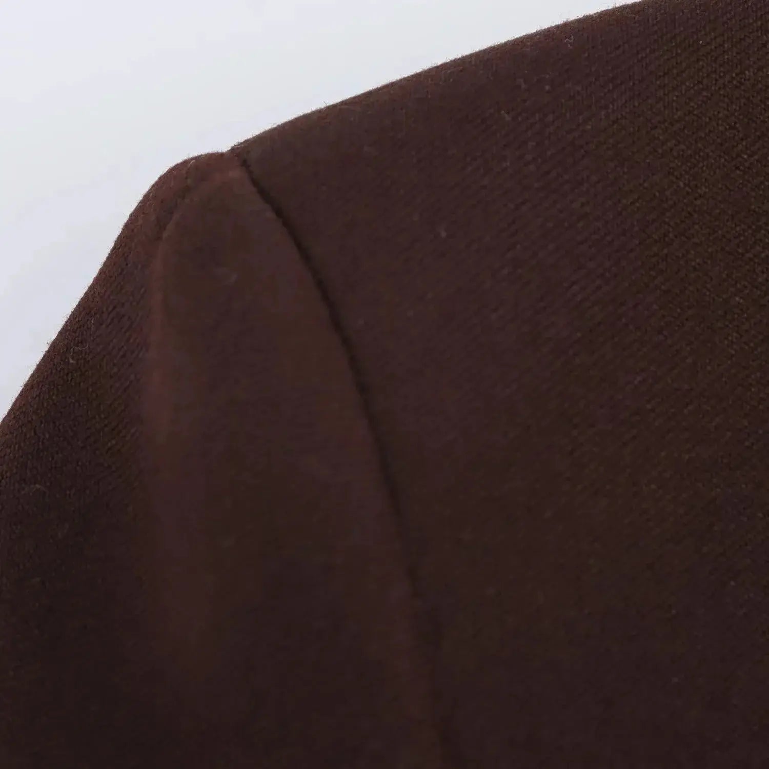 KONDALA brown blazer fabric close-up with seam detail