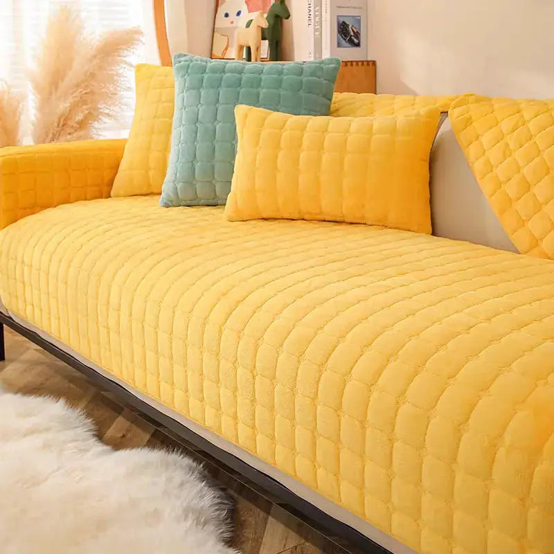Three-piece flannel sofa cushion set in yellow quilted fabric with teal accent cushion, non-slip.