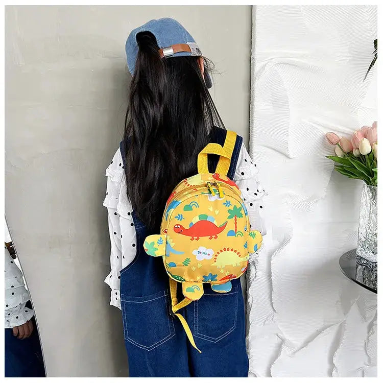 Cute children's yellow dinosaur backpack with cartoon print for kids