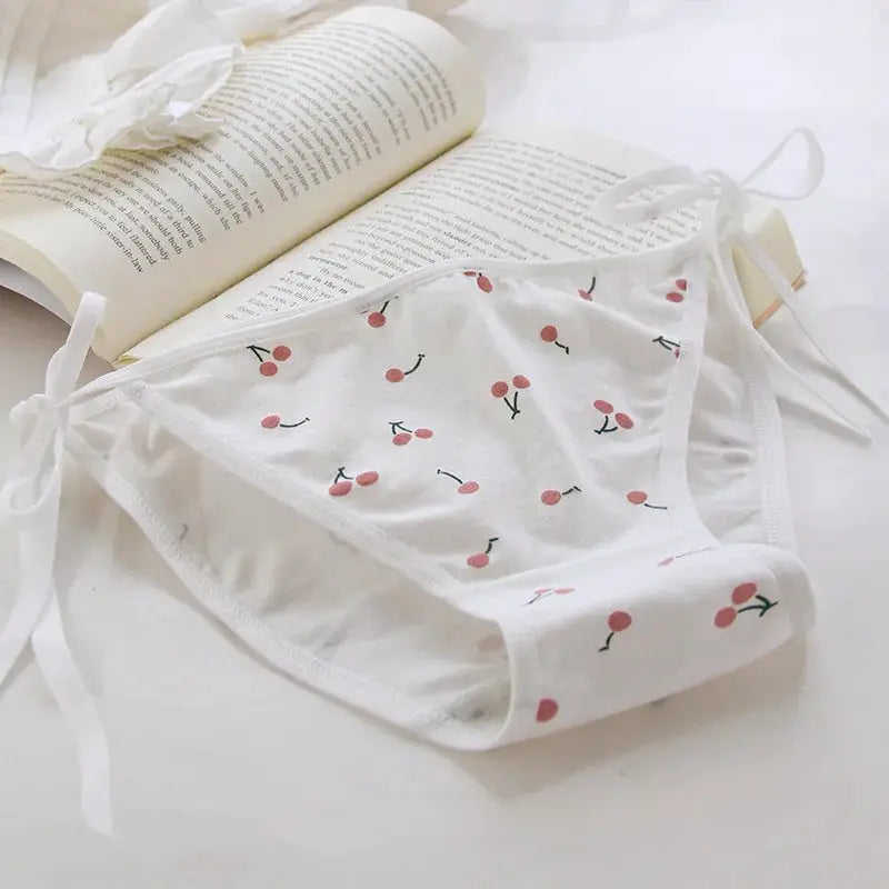 White cherry-print low-rise women's briefs with tie-side bows