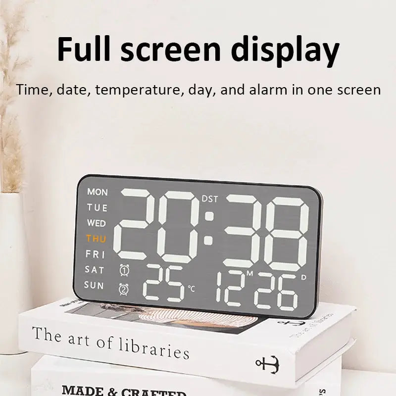 Mirror brushed finish wall clock with full-screen digital display showing time, day, date, and temperature