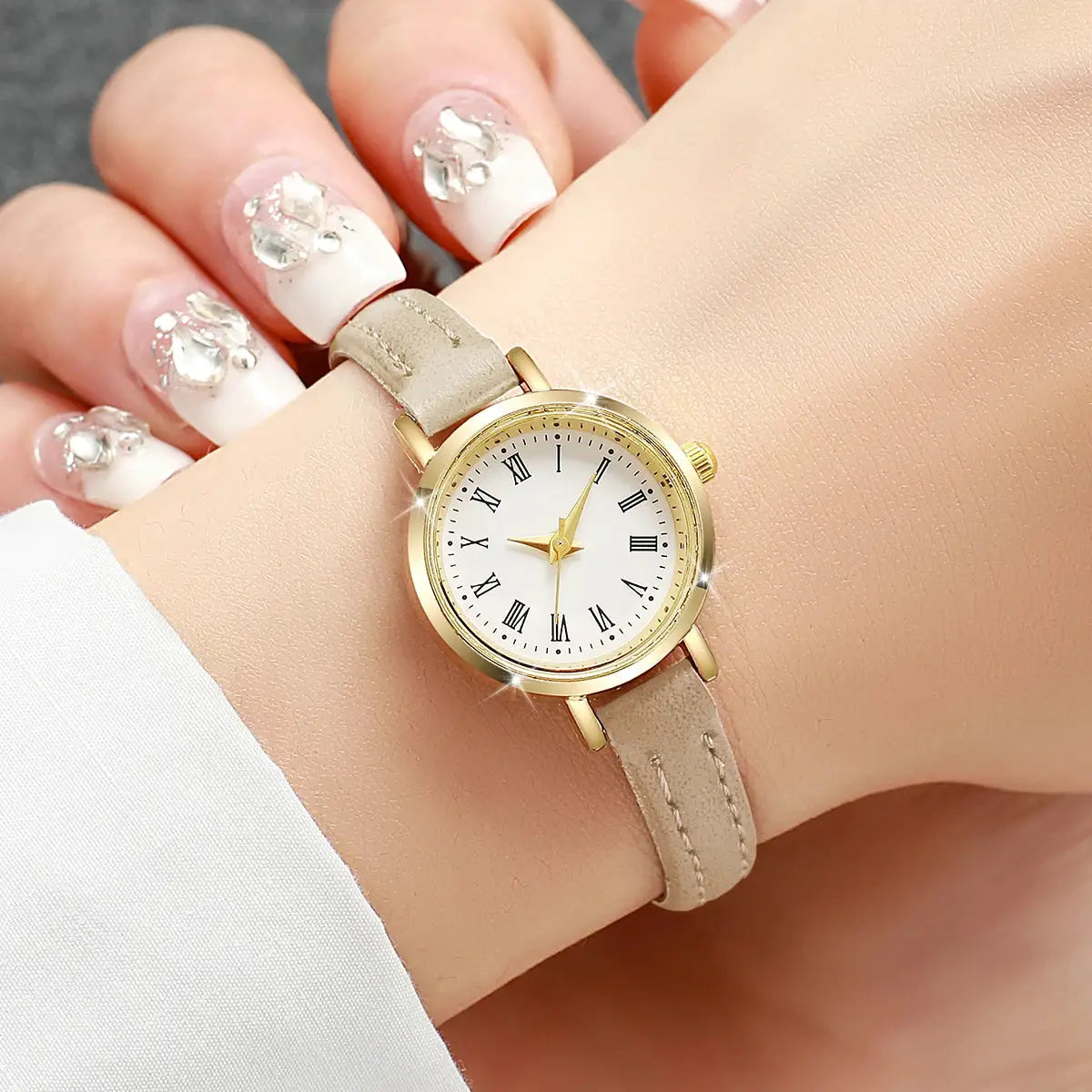 Women’s beige leather strap quartz watch by Simples Market; gold-tone case, Roman numeral dial