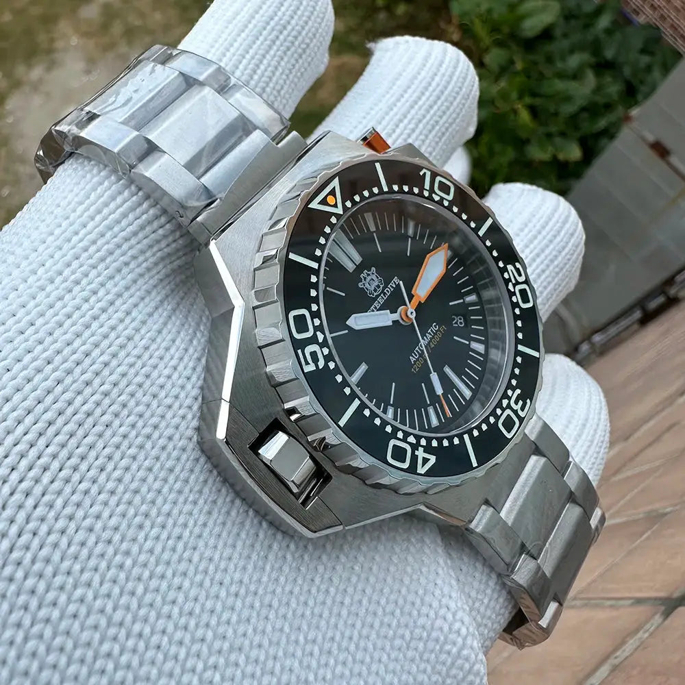 Steeldive Proplof SD1969 V3 steel dive watch on metal bracelet; 56mm oversized case, black bezel, orange accents.