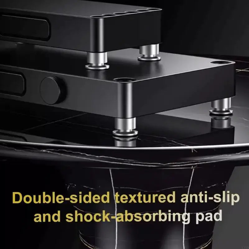 Aluminum magnesium alloy spikes by Simples Market for sound system vibration absorption on a black platform.