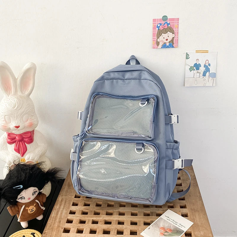 Ita bag backpack in blue with clear front mesh pockets and multiple compartments