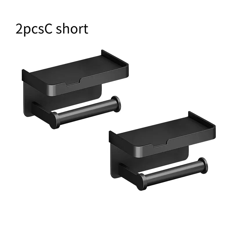 Two black aluminum alloy wall-mounted toilet paper holders with shelf and phone stand