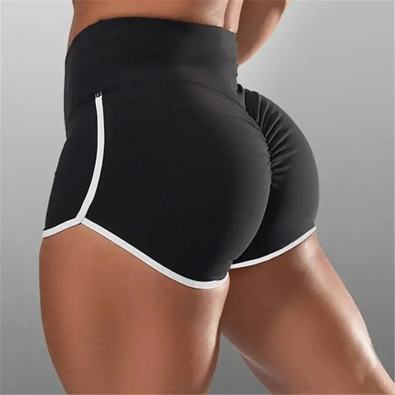 Women’s black gym shorts with white piping, stretchy fabric and high-waisted fit