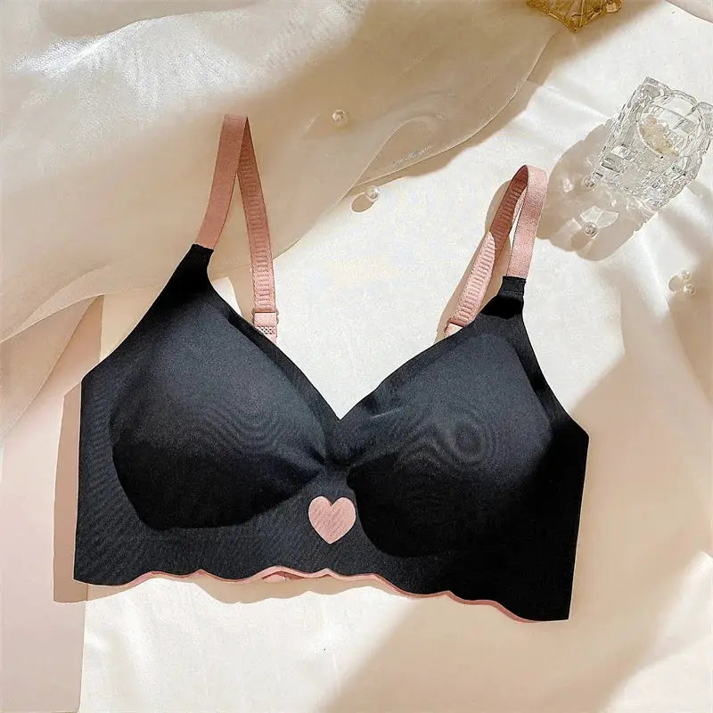 Push-up bra by Simples Market, black with pink heart motif and scalloped pink trim, adjustable pink straps