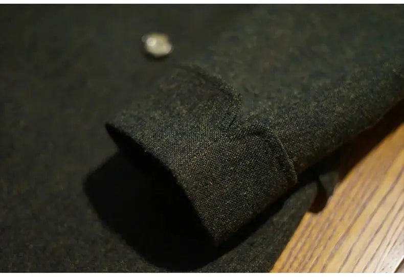 Men's green wool-blend overcoat with cuffed sleeve and button detail