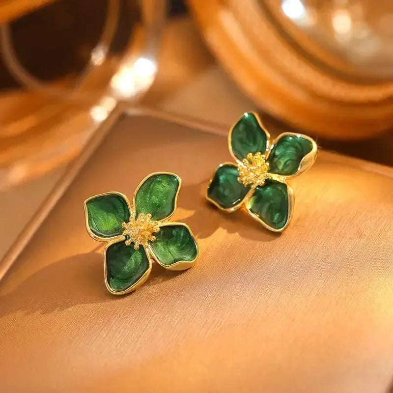 Simples Market earrings; green enamel flower design with gold trim and crystal centers, pair