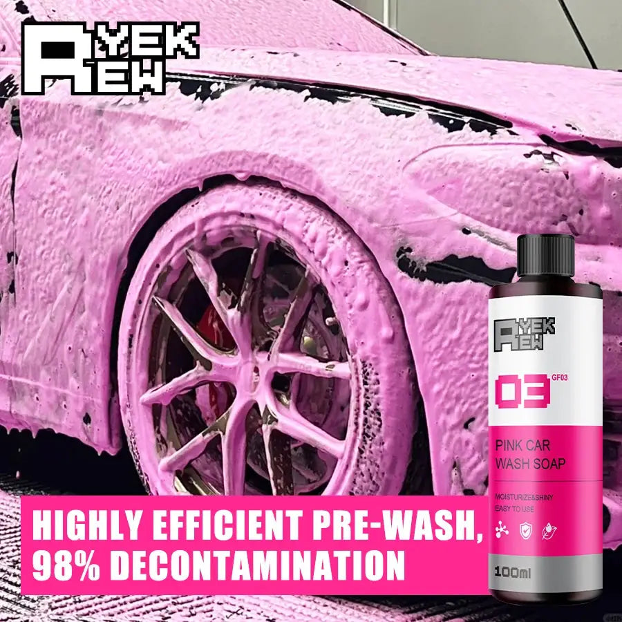 Pink car wash soap bottle by Simples Market beside a pink-foamed car