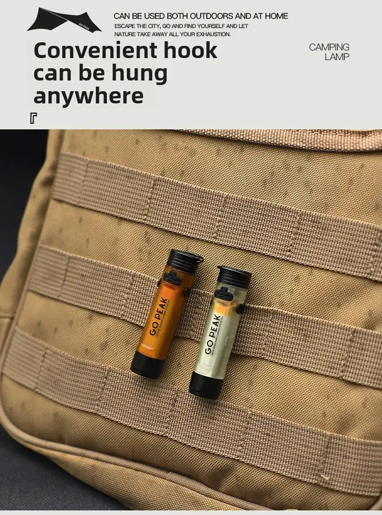 Go Peak mini pocket LED flashlights (2), USB-rechargeable orange and olive clip-cap torches on a tan tactical bag.