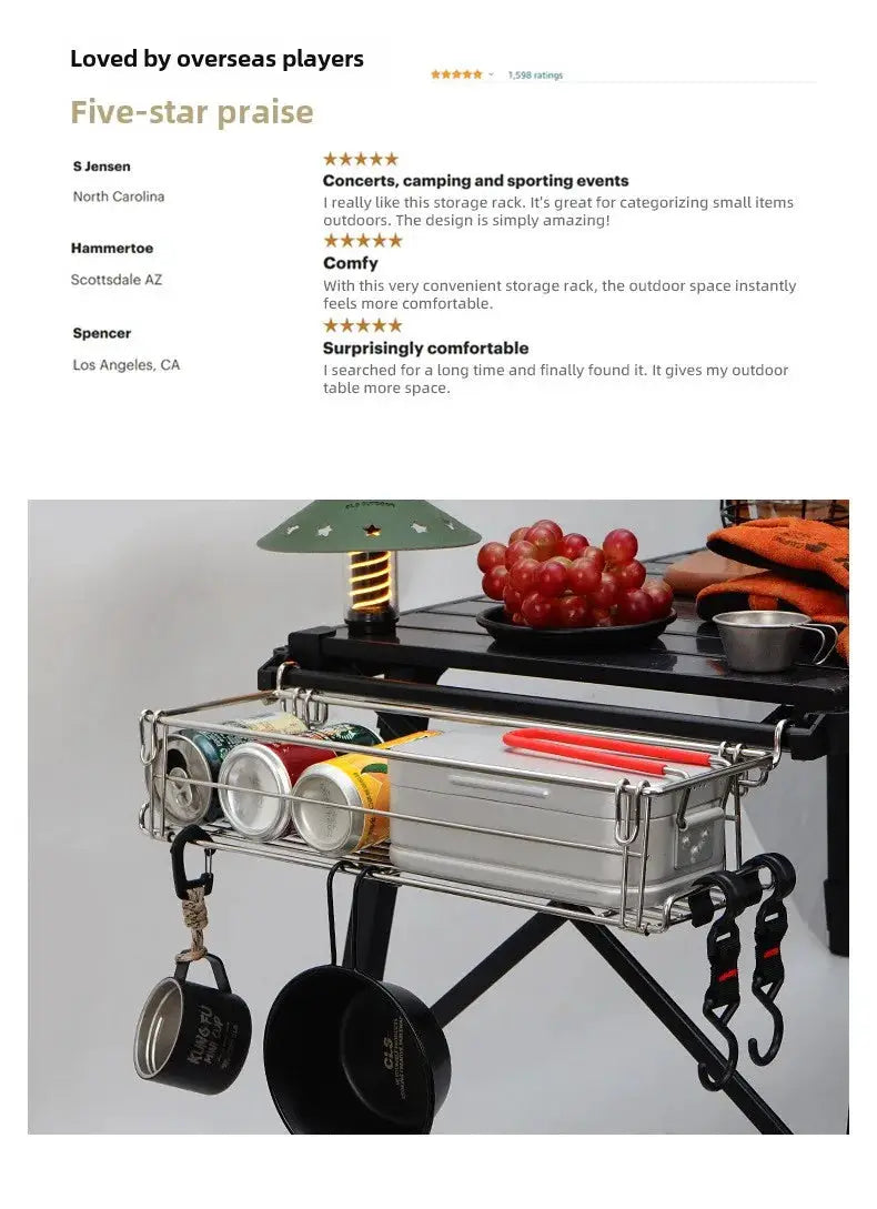 Outdoor aluminum table-side storage rack with a hanging mesh basket and utensil hooks on a folding table