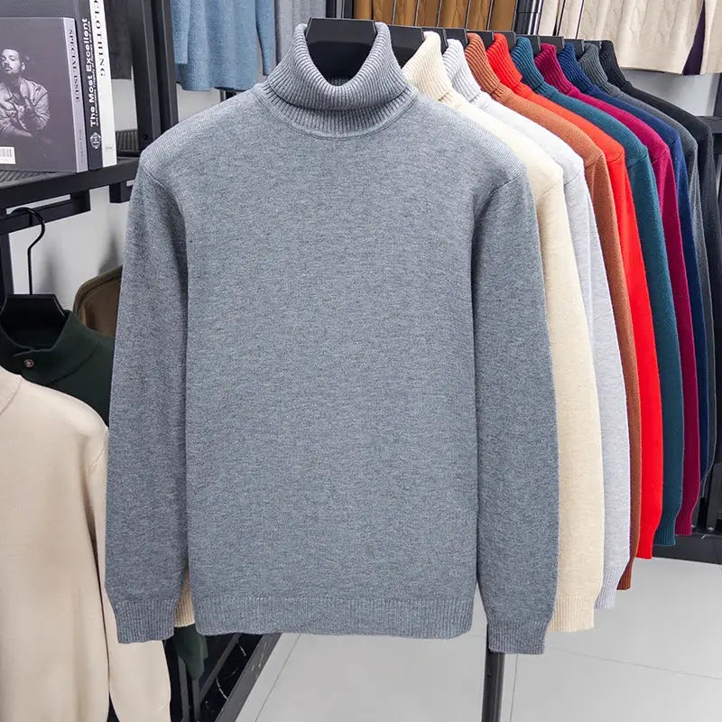 Men's knitted turtleneck sweater in gray; long sleeve, anti-pilling, on display with several color options on rack