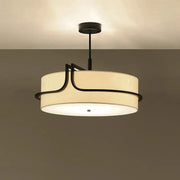 Modern fabric art ceiling chandelier with black metal accents and beige drum shade pendant light