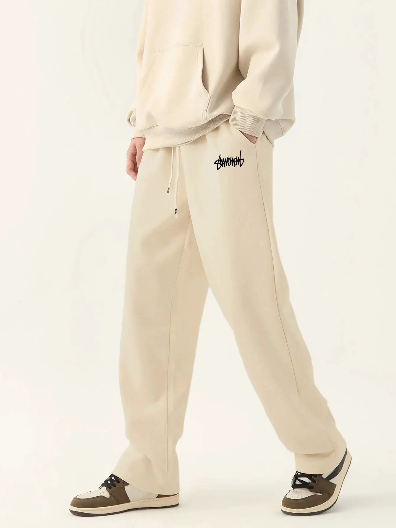 Men's beige baggy joggers with drawstring, black thigh logo, breathable casual pants
