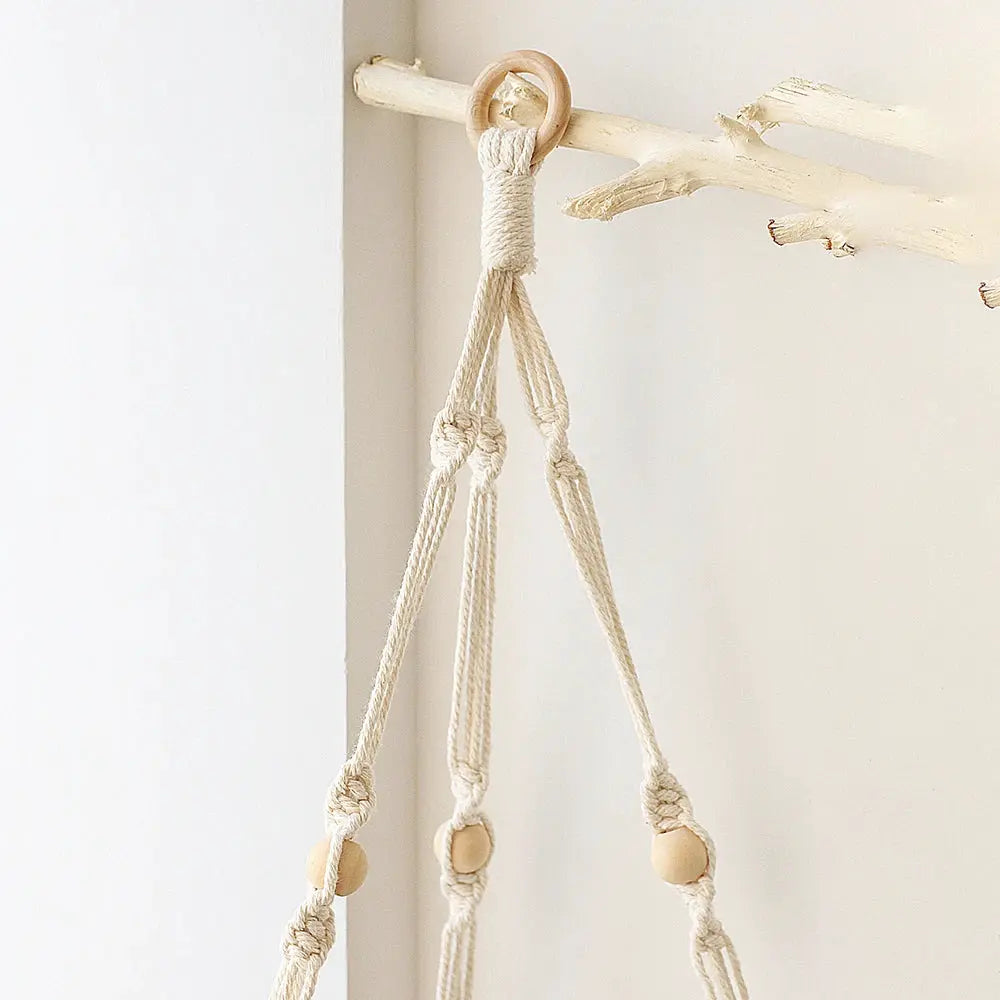 Macramé hanging decor by Simples Market, natural cotton rope with wooden beads in cream.