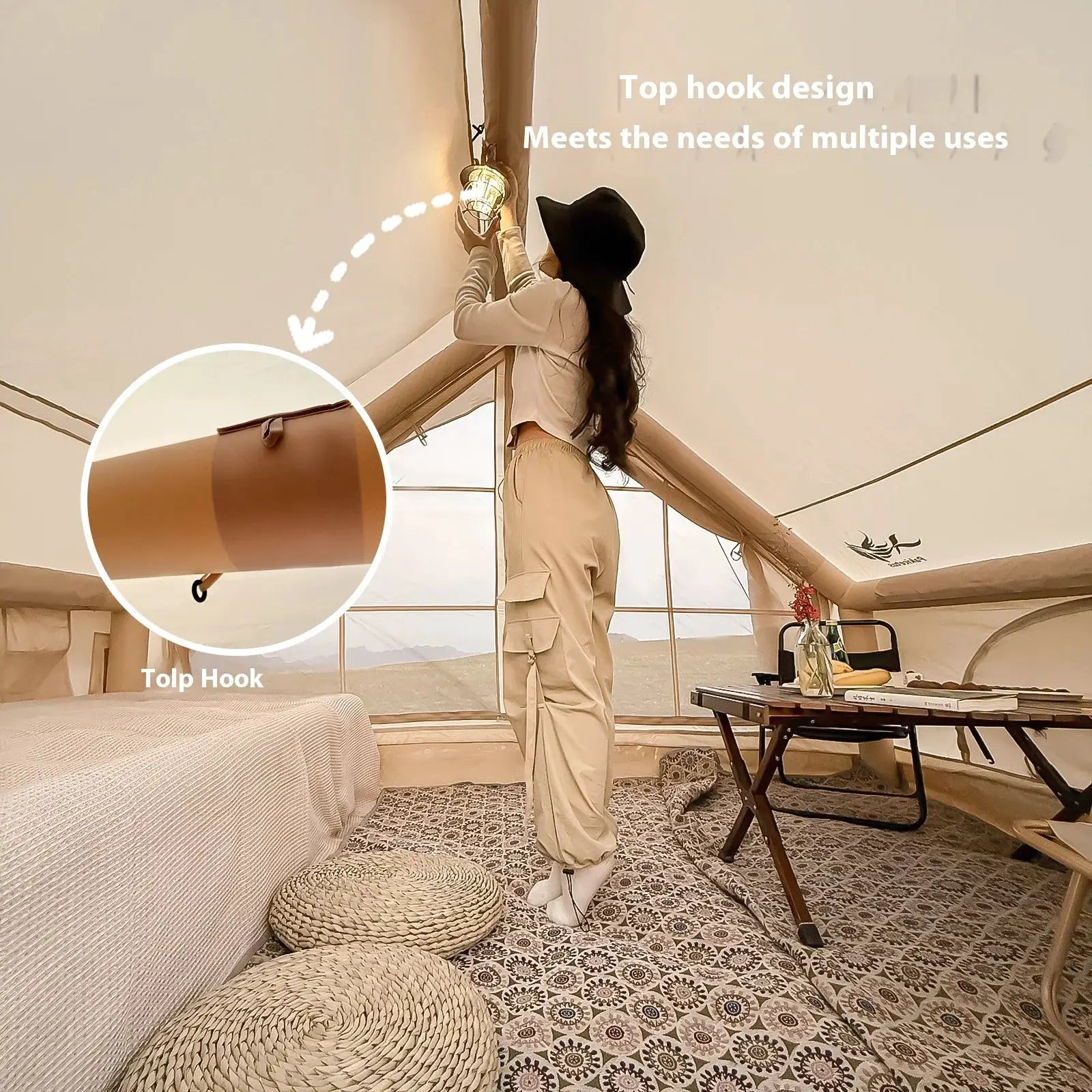 Inflatable camping tent interior in beige, luxury setup with woven floor cushions and a hanging light